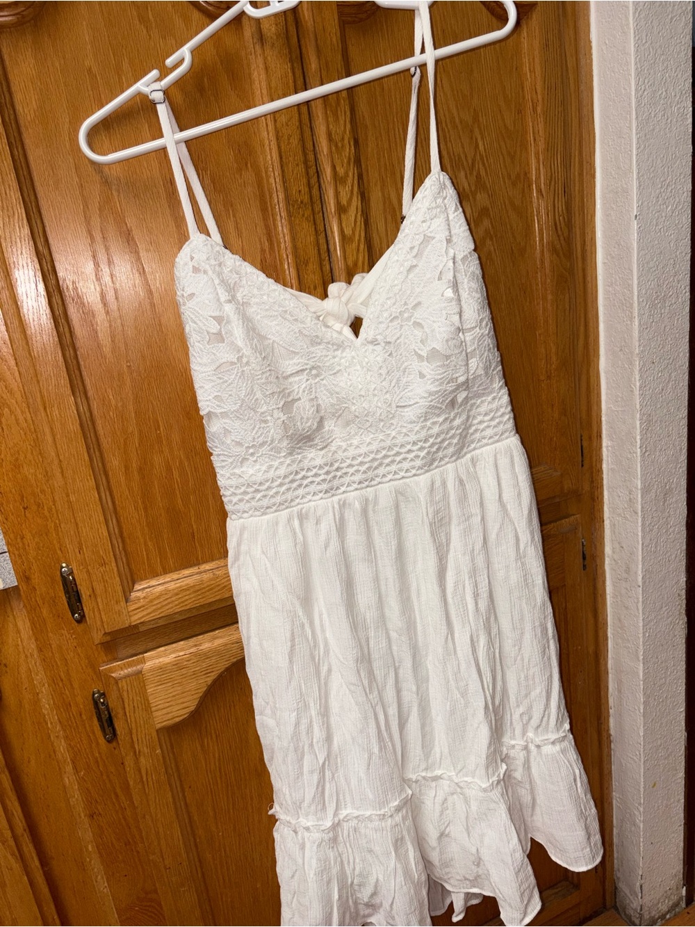 Shyanne White Lace Bust with spaghetti straps and bow tie in back midi Dress